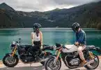 woman in black helmet riding on black motorcycle during daytime