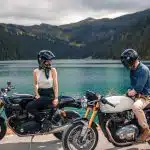 woman in black helmet riding on black motorcycle during daytime