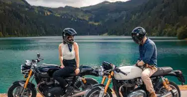 woman in black helmet riding on black motorcycle during daytime